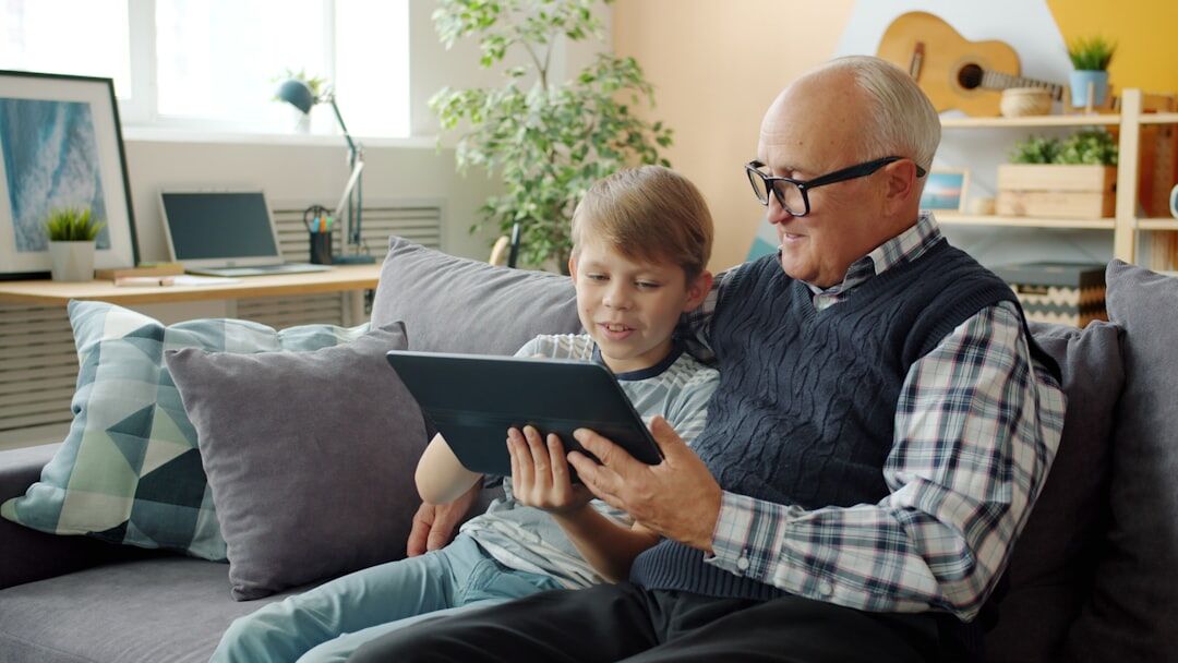 senior reading on tablet