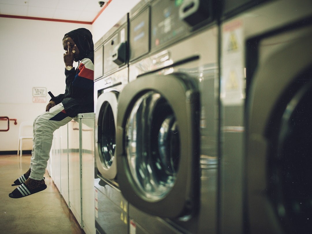 senior using washing machine