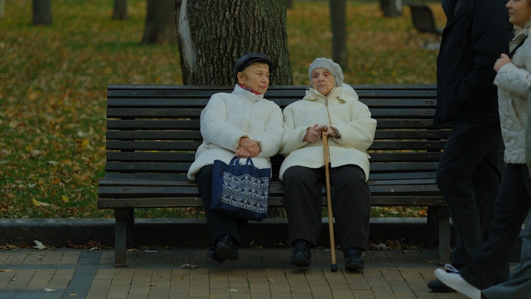 elderly couple walking in park