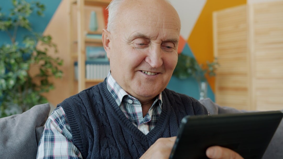 senior checking energy bill at home