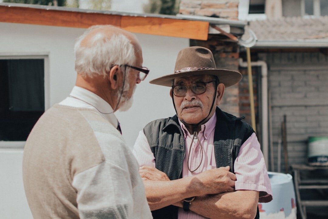 elderly people discussing documents